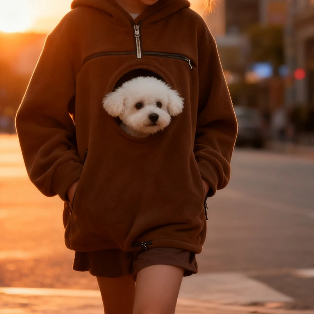 Brown pet pouch hoodie on an evening walk with a small dog